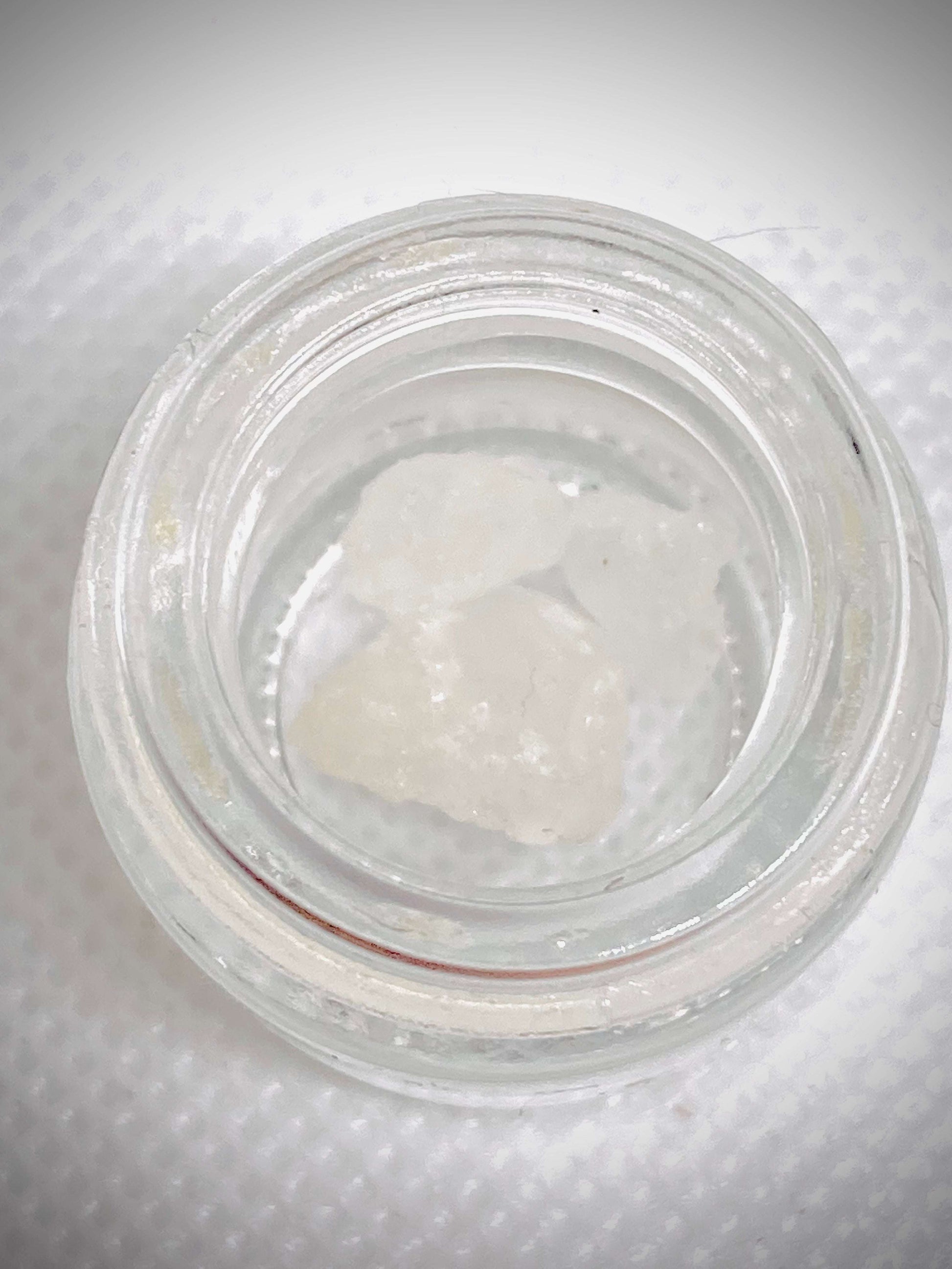 High-quality THCa diamonds concentrate from I Am Hemp Inc with 87% potency, showing clear, crystalline cannabis extract.