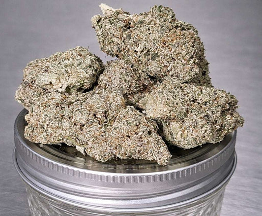Indoor THCa Flower Lemon Cookies by I Am Hemp Inc with vibrant green buds and orange-hued trichomes.