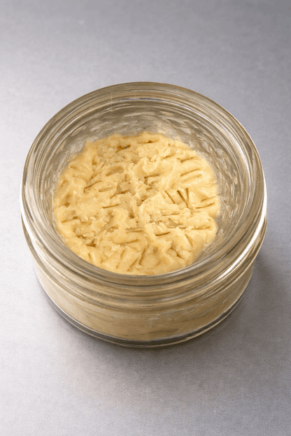 1 gram of I Am Hemp Inc live hash rosin concentrate with 78.6% potency, shown in a clear container with golden, sticky resin.