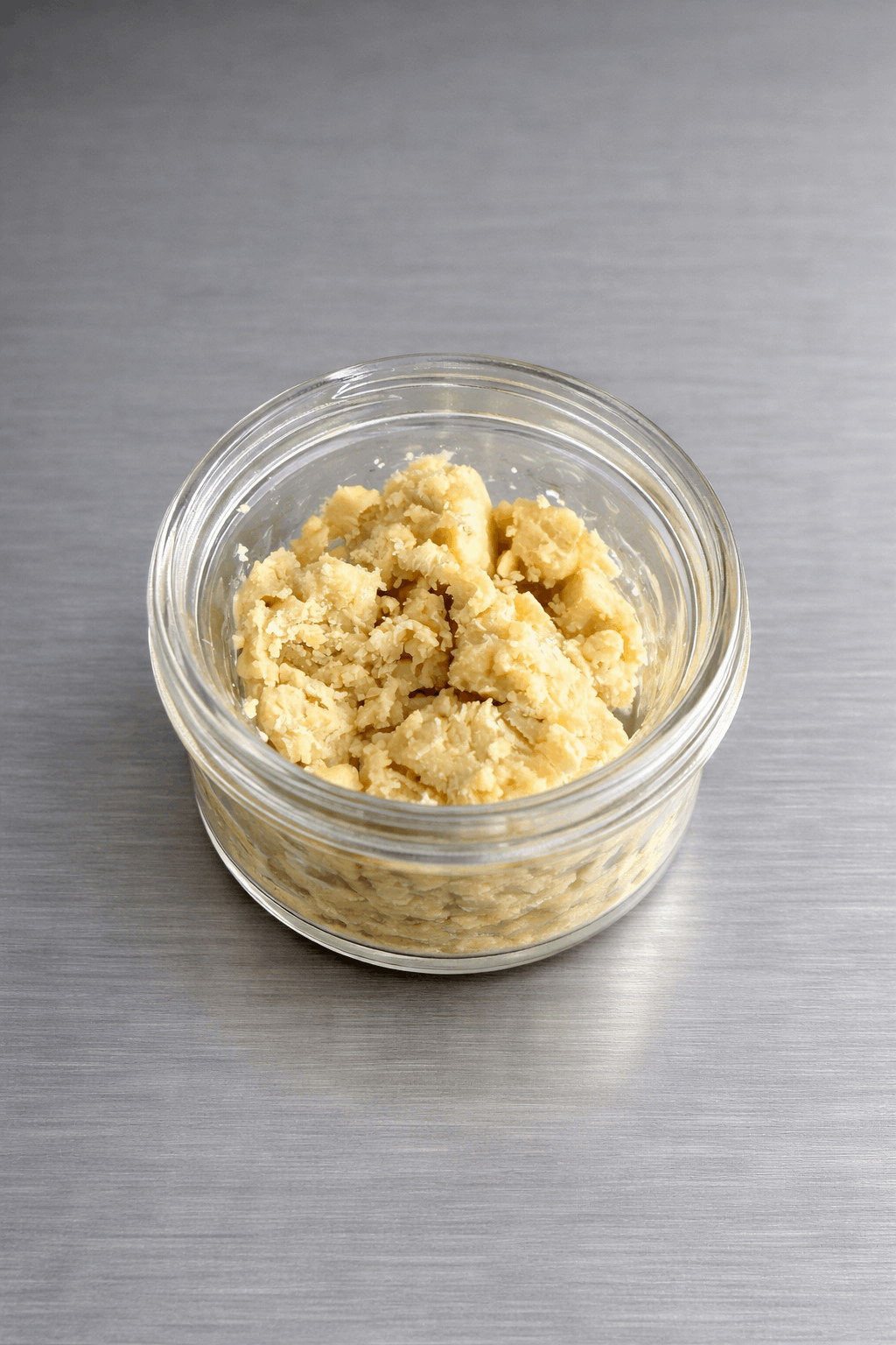 Close-up of 1 gram I Am Hemp Inc Live Hash Rosin concentrate with 78.6% potency, showing its golden, sticky texture and form.