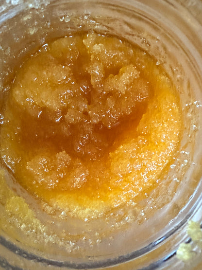 Close-up of 1 gram I Am Hemp Inc THCa live resin concentrate with 94.1% potency, showcasing the sticky, amber-colored extract.