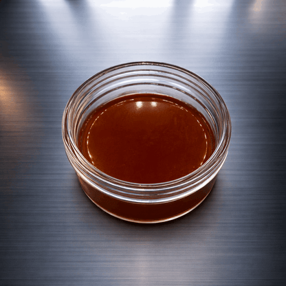 Apricot-colored I Am Hemp Inc CBDa live resin concentrate, 1 gram, with 89.9% CBDa content, showcasing a smooth, textured appearance.