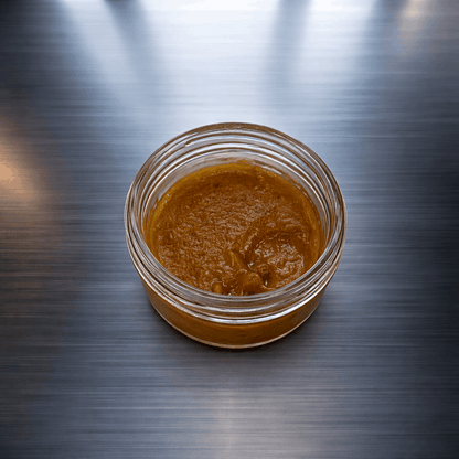 I Am Hemp Inc CBDa Live Resin concentrate in eraser Kush strain, showcasing a rich, resinous cannabis extract with vibrant color.